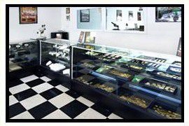 Modern bakery display cases with black and white checkered floor.