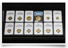 A collection of assorted gold coins in protective holders.