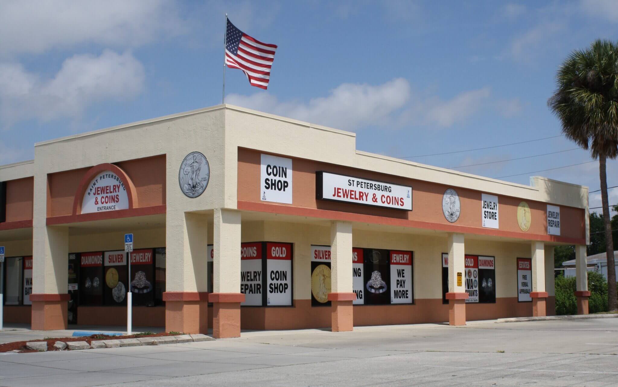 Exterior of a pizza and wings restaurant with an American flag.